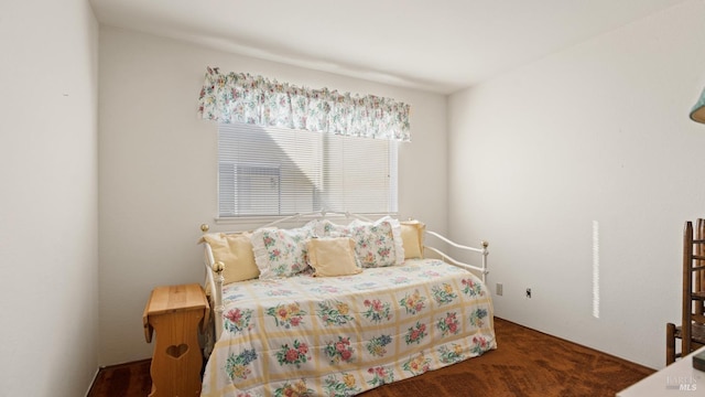 bedroom featuring dark carpet