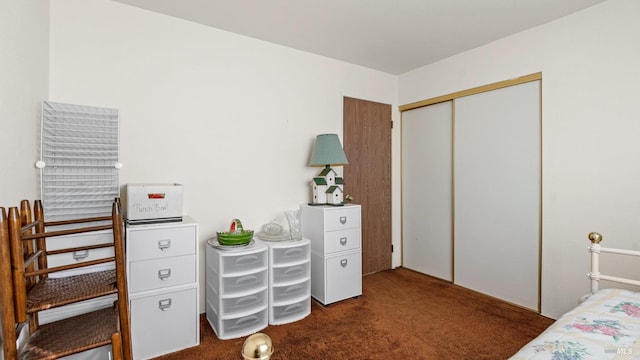 carpeted bedroom featuring a closet