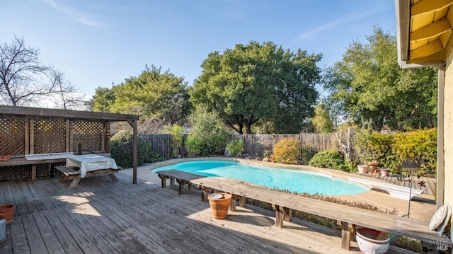 view of swimming pool with a deck