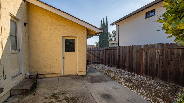 view of side of home featuring a patio area