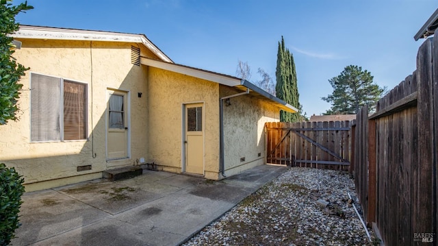 view of property exterior with a patio