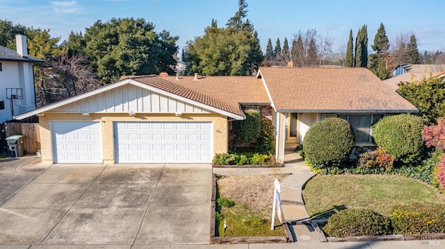 ranch-style home with a garage and a front yard