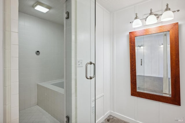 bathroom featuring a shower with shower door