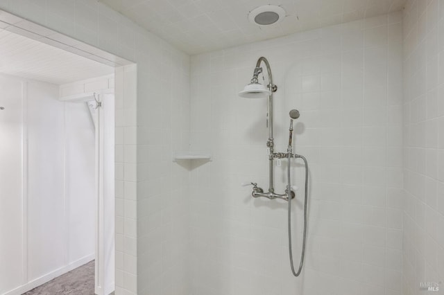 bathroom with a tile shower