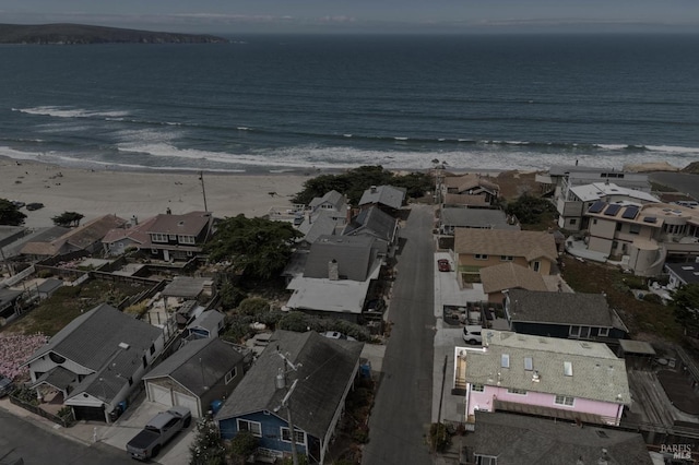 birds eye view of property featuring a view of the beach and a water view