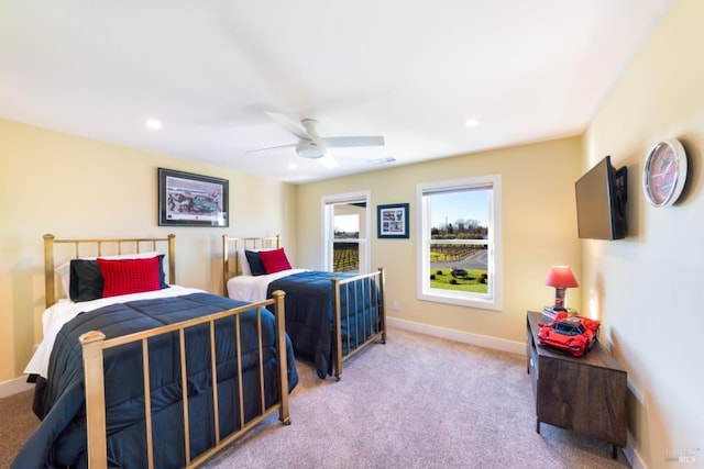 carpeted bedroom featuring ceiling fan