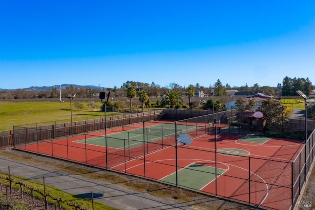 view of sport court featuring basketball hoop