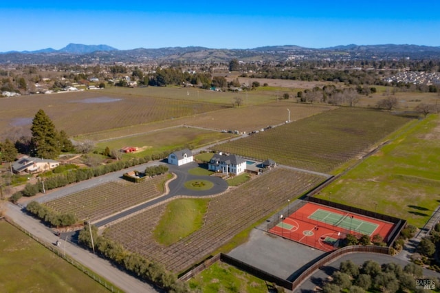 birds eye view of property with a mountain view and a rural view