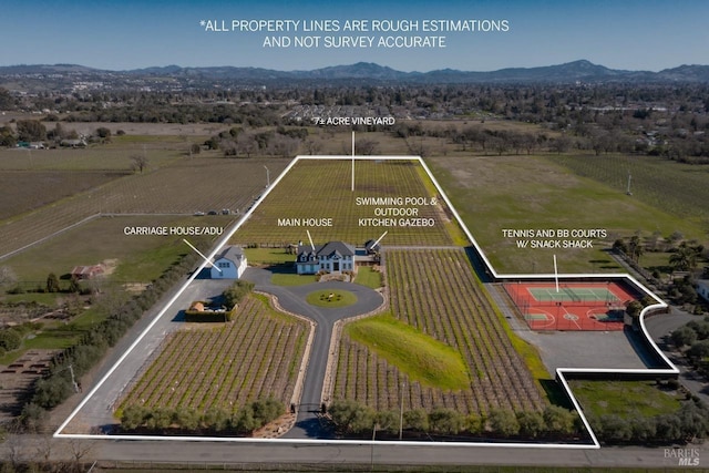 bird's eye view featuring a mountain view and a rural view