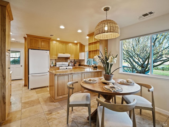 dining room with recessed lighting, visible vents, and plenty of natural light