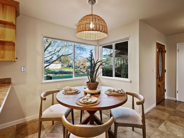 dining area featuring baseboards