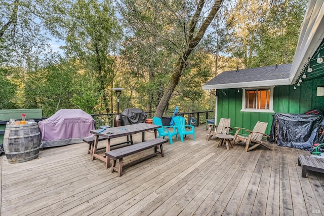 wooden deck featuring area for grilling