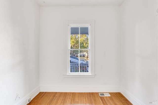 unfurnished room featuring hardwood / wood-style floors