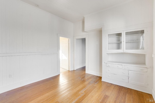 spare room with light hardwood / wood-style flooring