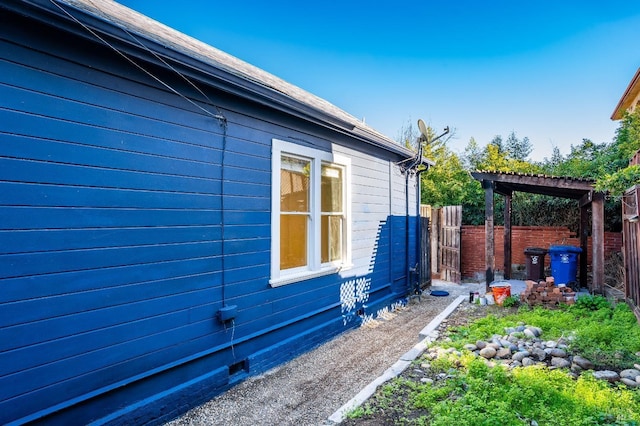 view of side of home featuring a pergola