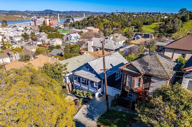 birds eye view of property featuring a water and mountain view