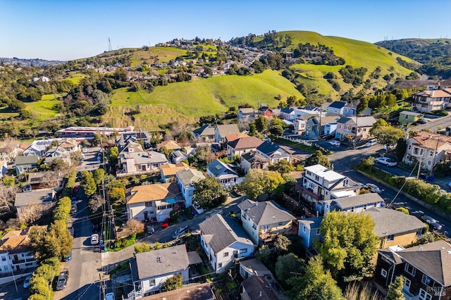 birds eye view of property with a mountain view