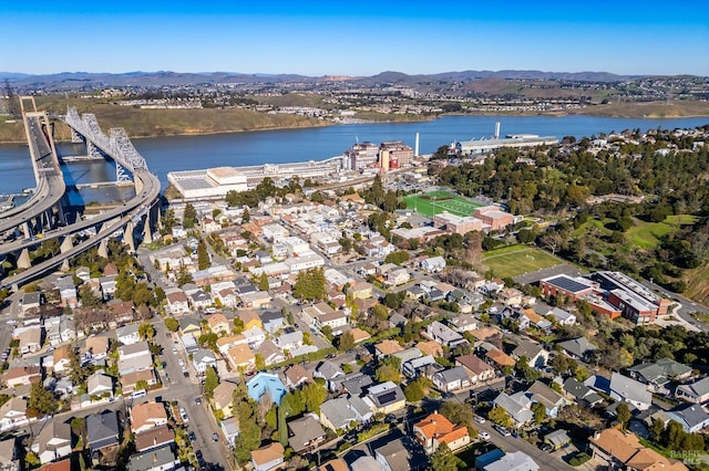 aerial view featuring a water and mountain view