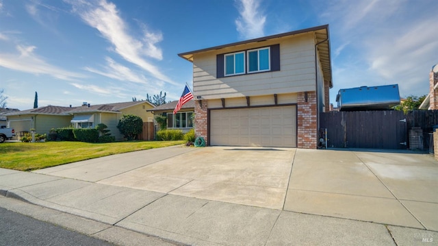 view of front of house with a garage and a front yard