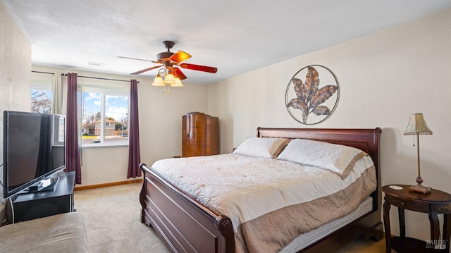 bedroom featuring ceiling fan and light carpet