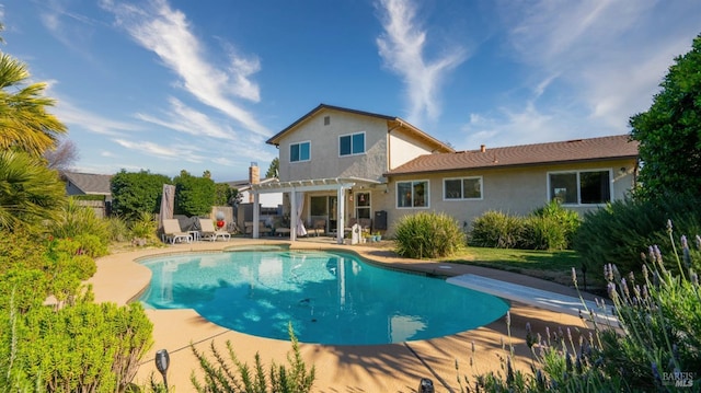 view of pool featuring a patio, a diving board, and a pergola