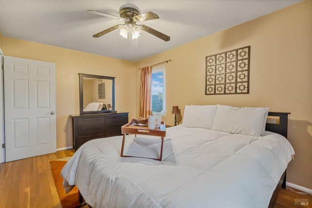 bedroom featuring ceiling fan and light hardwood / wood-style flooring