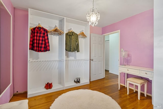 interior space with hardwood / wood-style floors and a chandelier