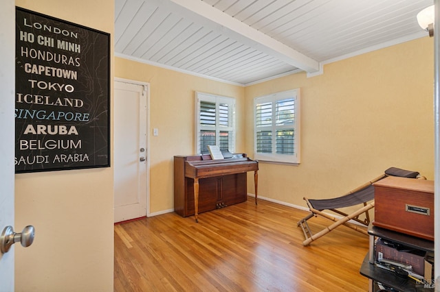 miscellaneous room featuring wood ceiling, beamed ceiling, and light wood-type flooring