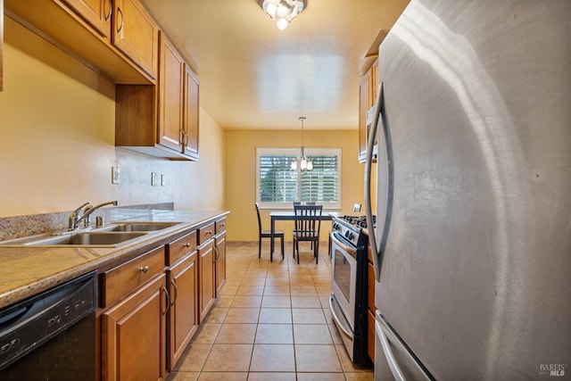 kitchen with sink, an inviting chandelier, light tile patterned floors, pendant lighting, and stainless steel appliances