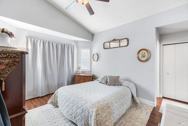 bedroom featuring ceiling fan, lofted ceiling, hardwood / wood-style floors, and a closet