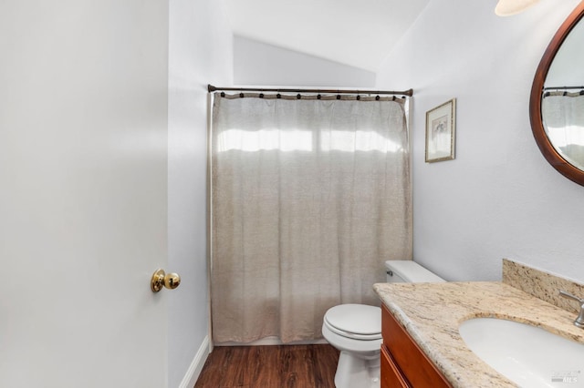 full bathroom featuring hardwood / wood-style floors, lofted ceiling, vanity, toilet, and shower / bathtub combination with curtain