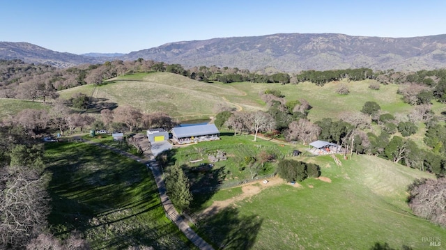 drone / aerial view featuring a mountain view and a rural view