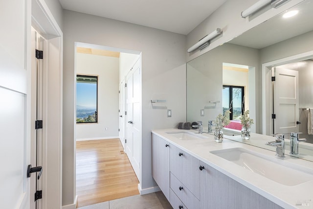 bathroom with tile patterned floors and vanity