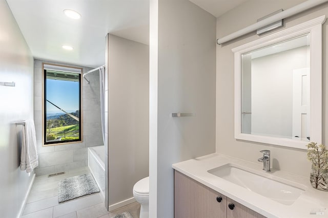 bathroom featuring tile patterned floors, vanity, and toilet