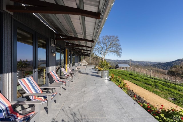 view of patio / terrace with a mountain view