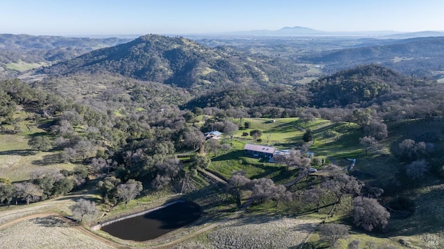 aerial view featuring a water and mountain view