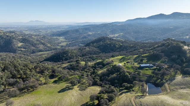 aerial view featuring a water and mountain view