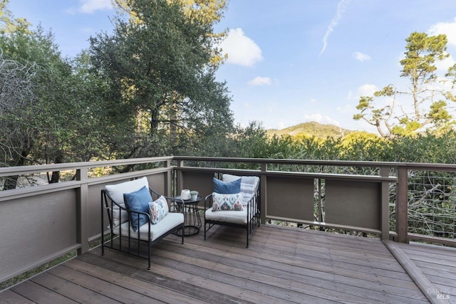 wooden terrace featuring a mountain view