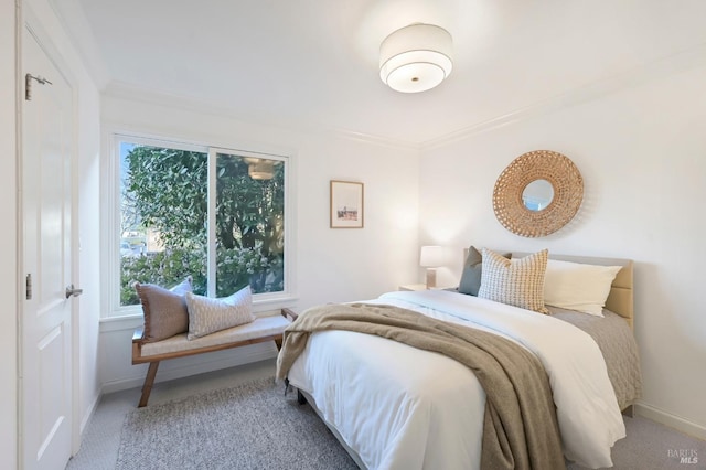 carpeted bedroom with crown molding