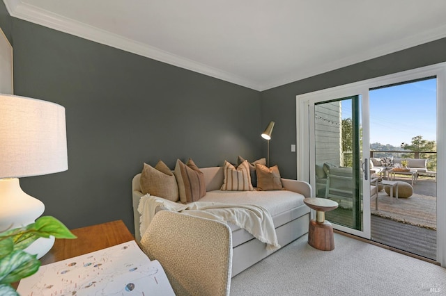 bedroom with crown molding and access to exterior