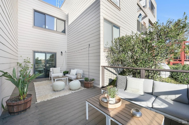 wooden terrace with outdoor lounge area