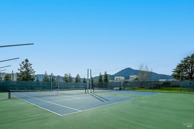 view of sport court with a mountain view