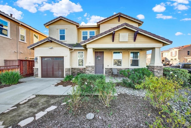 craftsman house featuring a garage and covered porch