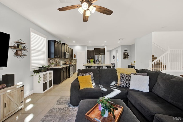 living room with stairway, light tile patterned floors, visible vents, recessed lighting, and ceiling fan