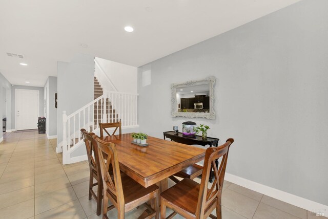 dining room featuring visible vents, recessed lighting, stairway, light tile patterned flooring, and baseboards