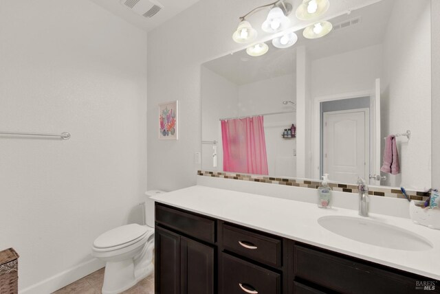 bathroom featuring visible vents, toilet, a shower with shower curtain, tile patterned flooring, and vanity