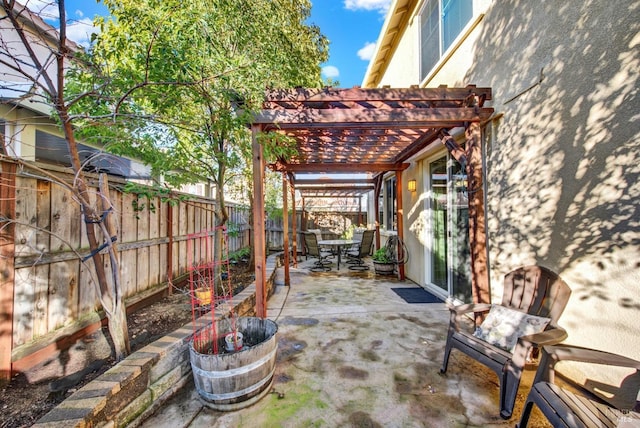 view of patio featuring a fenced backyard and a pergola