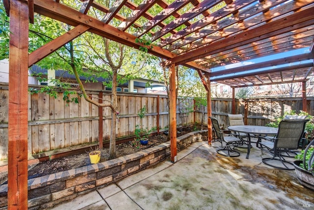 view of patio featuring a fenced backyard, outdoor dining space, and a pergola