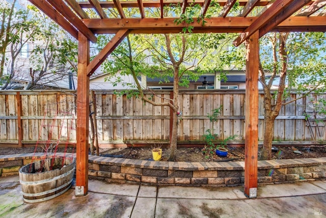 view of patio / terrace with a pergola and fence