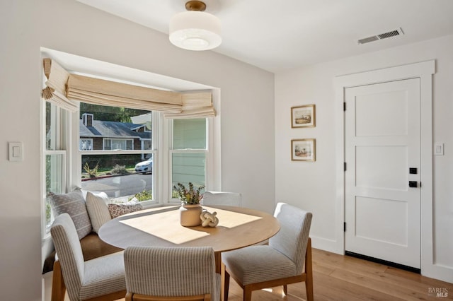 dining space featuring light hardwood / wood-style flooring